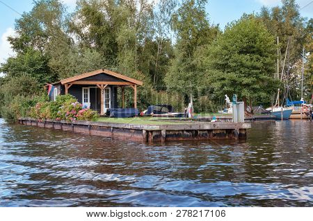 Loosdrecht, Netherlands - September 3 , 2017:  Recreation House With Mooring For Boat On The Bank Of