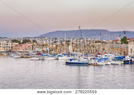Travel Concepts. Picturesque Image Of Old Venetian Harbour Of Chania With Line Of Fisihing Boats And