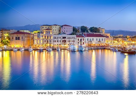 Travel Concepts. Picturesque Image Of Old Venetian Harbour Of Chania With Fisihing Boats And Yachts 