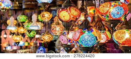 Stained Glass Lamps In Grand Bazaar, Istanbul, Turkey. Panoramic View Of Colorful Oriental Gifts. Be