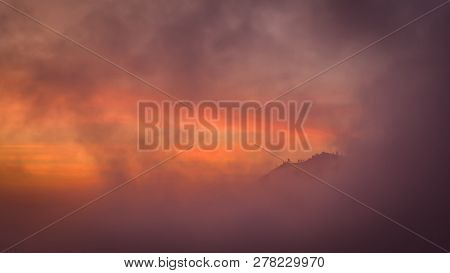 View Through The Clouds To The Mountains