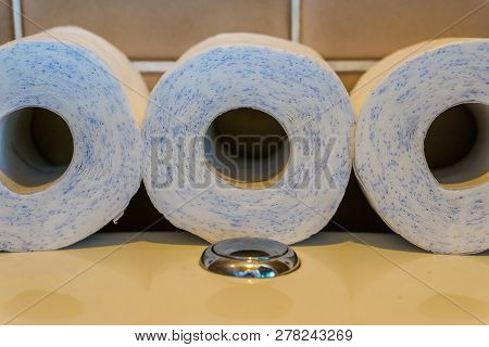Row Of Toilet Paper Rolls Laying On The Water Closet, Bathroom Products, Sanitary Background