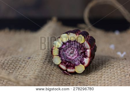 Fresh Purple Corn Fruit Isolate On White Cut Haff