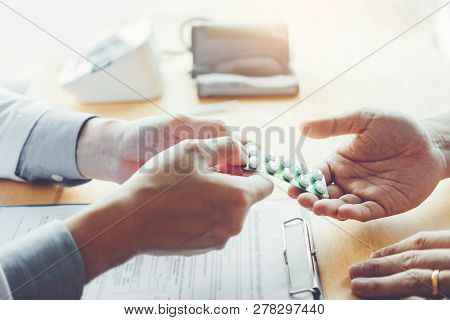 Doctor Or Physician Recommend Pills Medical Prescription To Male Patient