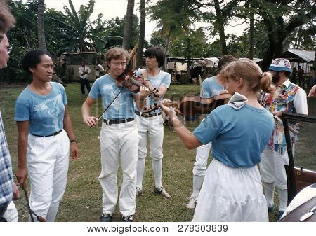 Nukualofa / Tonga - Circa July, 2000: Two Violinists Play Together, Prior To A Performance By The To
