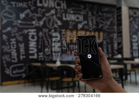 Chiang Mai, Thailand - Jan. 06,2019: Man Holding Huawei With Uber Apps. Uber Is Smartphone App Trans