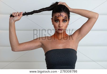 Woman who had her face painted for a fall festival