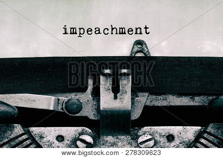 Impeachment Typed On Vintage Typewriter - Government And Politics Concept