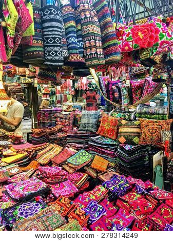 Chatuchak Weekend Market, Bangok, Thailand - May 19th, 2017: A Ccolourful Array Of Textile Goods Bei