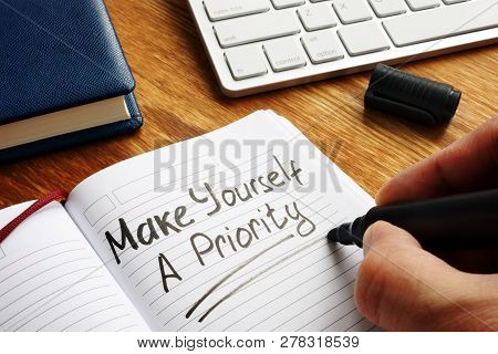Man Is Writing Make Yourself A Priority.
