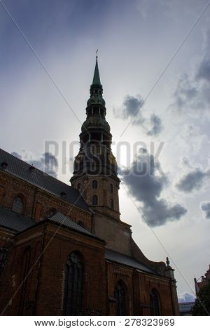 The Building Is Of Red Brick Of Different Levels. Windows Of Different Sizes. On The Windows Of The 