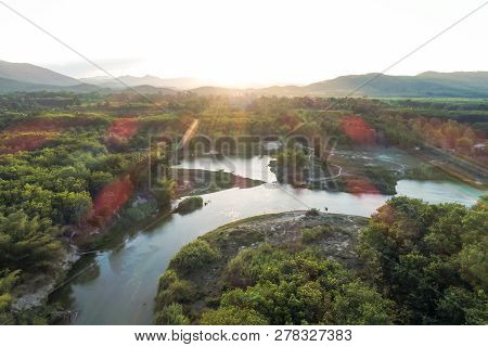 Green Nature Scenic Of Rain Forest With Curve Of River Sunrise