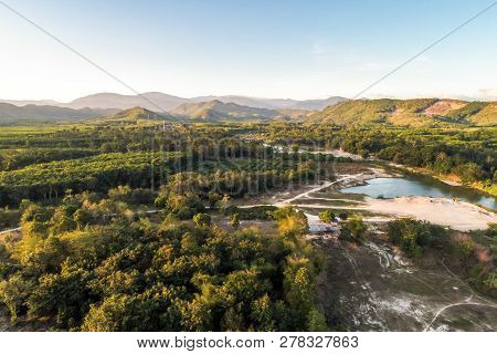 Green Nature Scenic Of Rain Forest With Curve Of River Sunrise