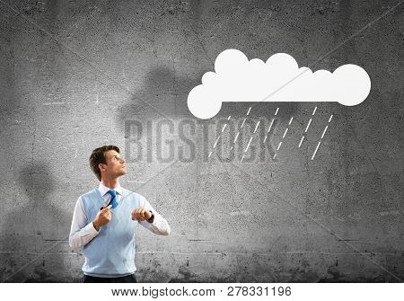 Horizontal Shot Of Confident And Young Businessman In Smart-casual Wear Smoking Pipe While Standing 