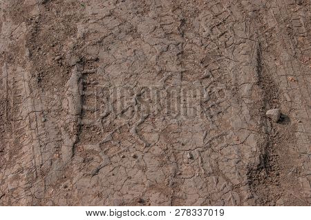 A Trace From The Car Wheel On Dusty Ground.