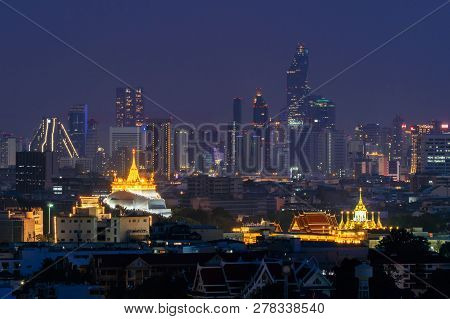 Golden Mount, Loha Prasat Wat Ratchanatda, And Skyscraper Buildings At Night In Bangkok City, Thaila