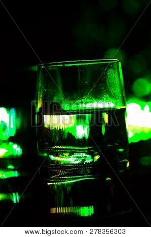 Colored Lighting Of Glasses In The Night Club Bar