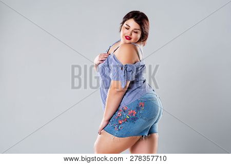 Plus Size Fashion Model In Jean Shorts, Fat Woman On Gray Studio Background, Overweight Female Body