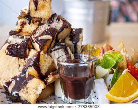 Close Up Of Sweet Dessert Mix Fruit Honey Toast With Chocolate Sauce And Ice Cream In The Restaurant