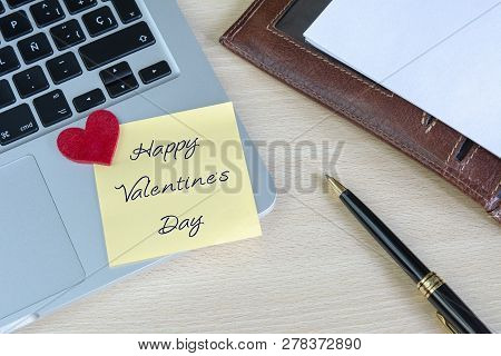 Happy Valentines Day Written In A Posit On The Work Desk