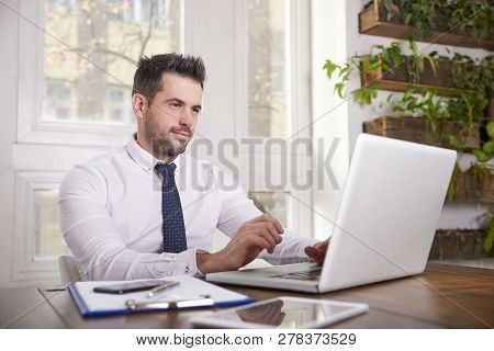 Businessman Working His Laptop In The Office