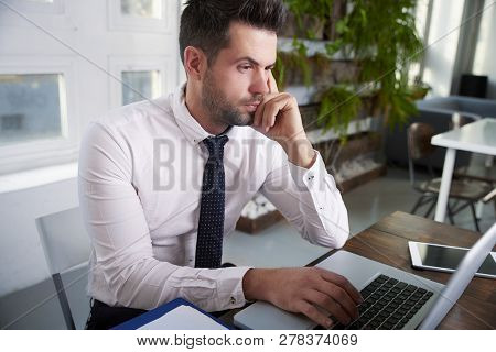 Businessman Working On Laptop In The Office