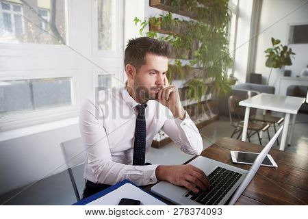 Businessman Working On Laptop In The Office