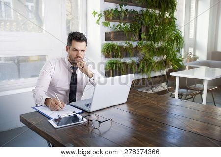 Businessman Working On Laptop In The Office