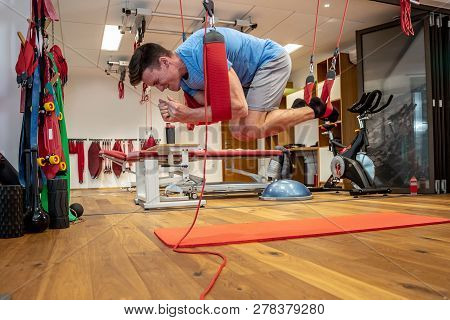 Person Works In A Well Equipped Gym, Proprioceptive Training, Core Stability, Injury Prevention