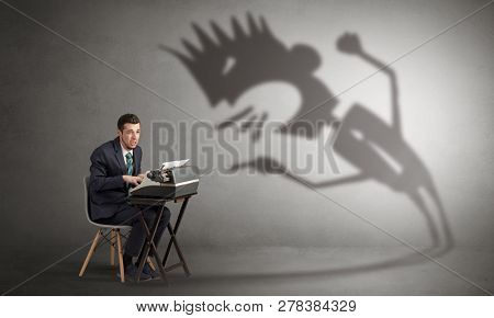 Man working hard and he is afraid of a yelling shadow