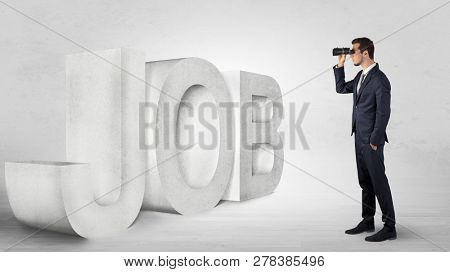 Handsome businessman looking forward with binoculars at a job, income and money concept