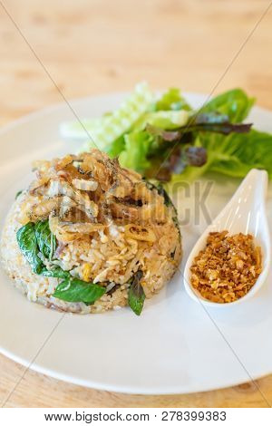 egg fried rice with fried Gourami with organic vegetable.