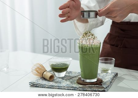 A Pretty Girl Is Making Snow Top Maccha Smoothies