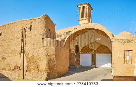 Yazd, Iran, October 18, 2017: The Halfly Ruined Adobe Buildings In The Street Of Historic Khan Bazaa