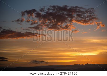Golden Sunset On Different Layers Of Clouds.