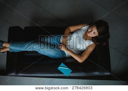 Young Business Woman Resting On The Office Sofa, Top View