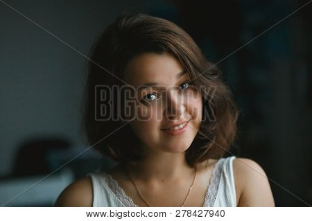 Young Pretty Woman Freelancer Looking To Camera
