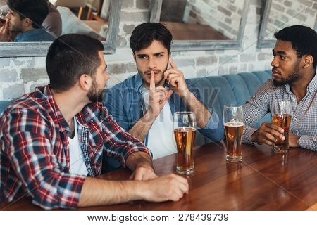 Man Asking For Silence, Talking On Phone, Sitting In Bar With Friends
