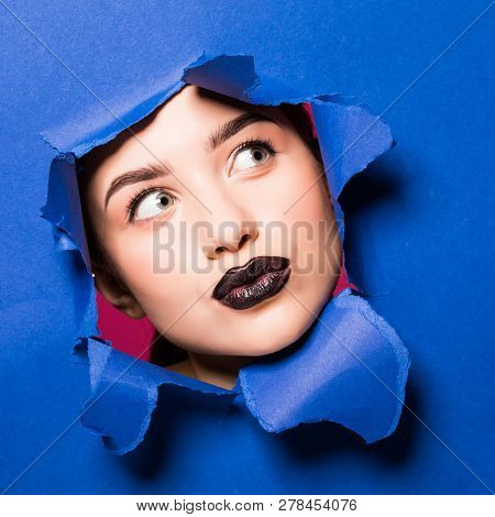 Original Beaty Close Up Of Girl Face Surronded By Blue And Pink Stiff Carton Sheets. Model Having Be