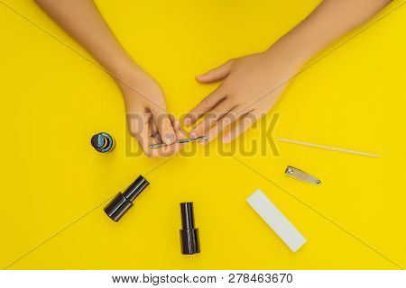 Woman Hands Care. Top View Of Beautiful Smooth Womans Hands With Professional Nail Care Tools For Ma