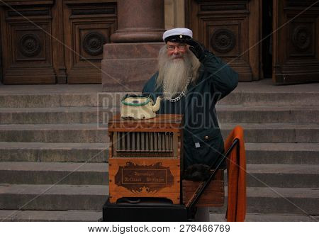 Helsinki, Finland - November 25, 2008: Elderly Organ Grinder On The Streets, With A Vintage Barrel O
