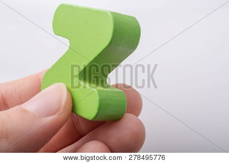 Hand Holding Letter Cube Z Of Made Of Wood