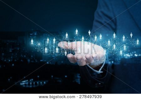 A Cobweb Of Social Networking Connections With Human Image Icons Is Hanging Above Female Hand Of A B