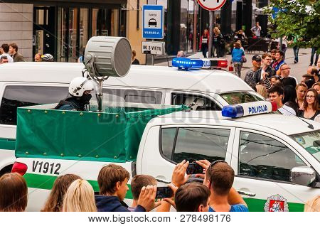 Vilnius, Lithuania - July 27, 2013: Police Cars Driving With Big Loudspeaker During The Pride Parade