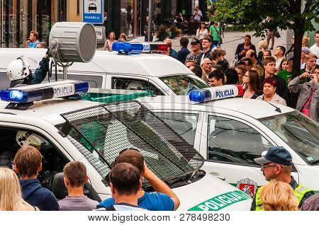 Vilnius, Lithuania - July 27, 2013: Police Cars Driving With Big Loudspeaker During The Pride Parade