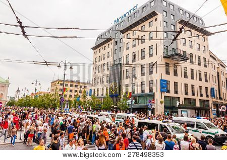 Vilnius, Lithuania - July 27, 2013: Police Cars Moving Through Street Full Of People During Pride Pa
