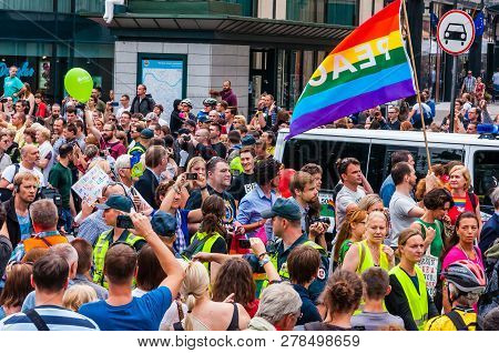 Vilnius, Lithuania - July 27, 2013: Pride Parade In Action. Crowd Of Watchers And Demonstrators With