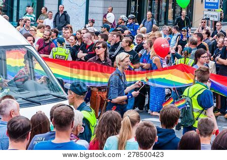 Vilnius, Lithuania - July 27, 2013: Pride Parade In Action. Crowd Of Watchers And Demonstrators With