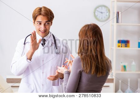 Deaf-mute female patient visiting young male doctor 