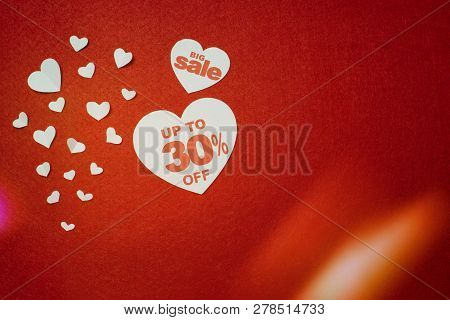 Symbol Of Heart For Big Sale With 30 Percent Next To Other Smaller White Hearts On The Red Backgroun